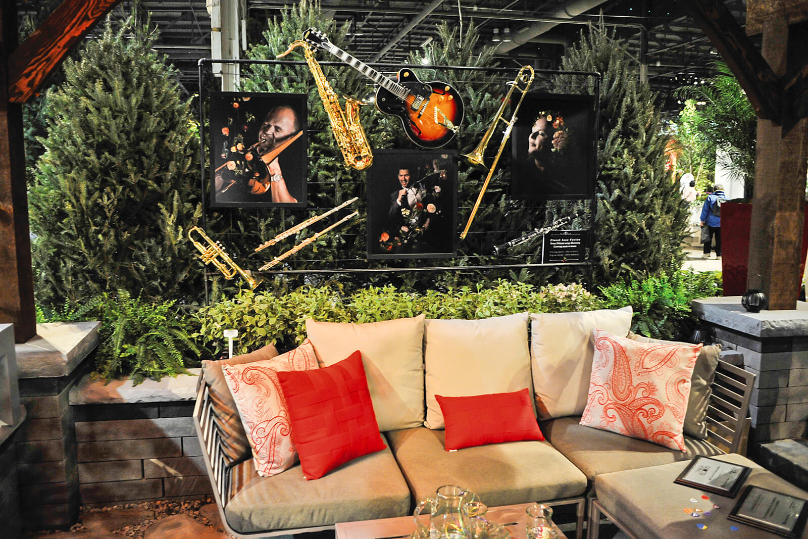 feature garden with couch and musical instruments suspended above