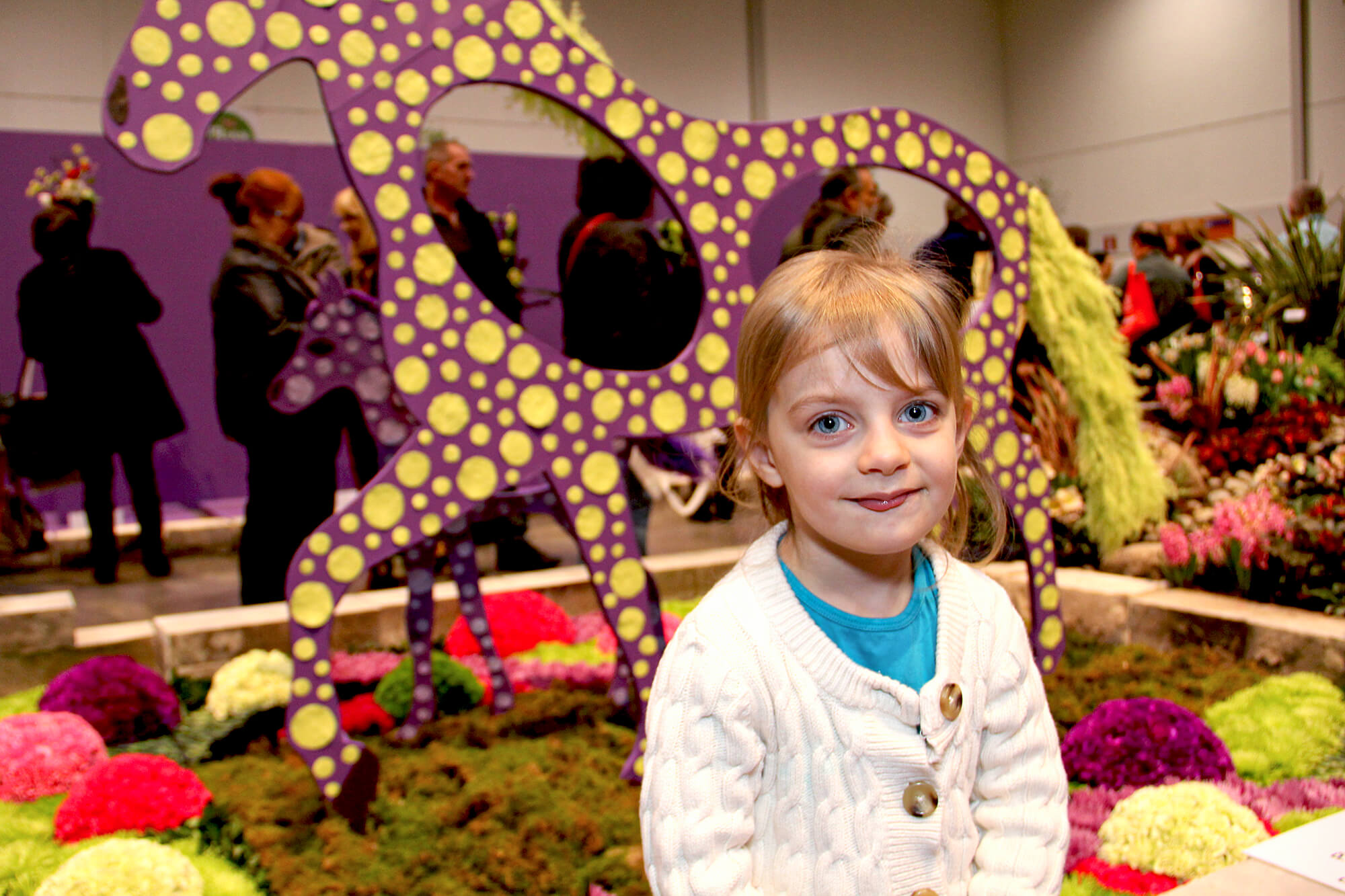 young girl at a flower show